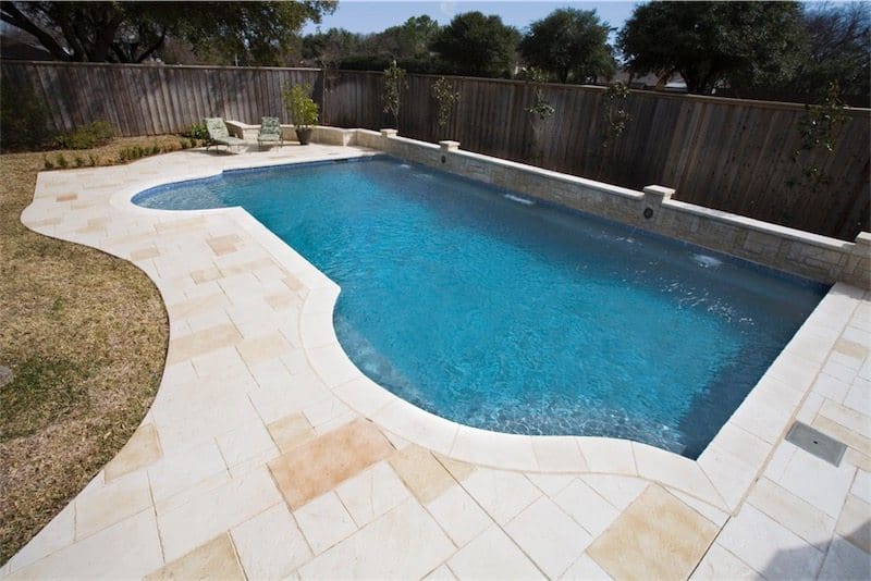 Beautiful custom shaped swimming pool with water jets