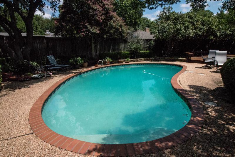 before renovation of a simple freeform pool