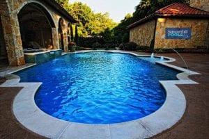 traditional pool with water features
