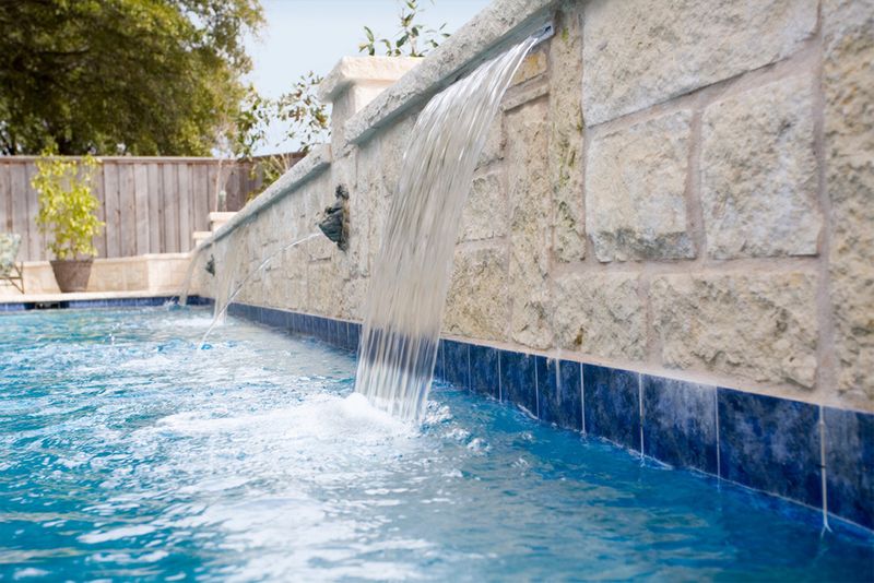 Water feature with blue tile.