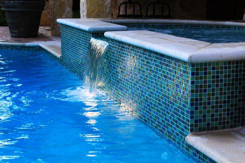 glass tile on spa with water feature