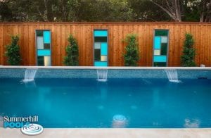 beautiful glass tile wall in a backyard pool
