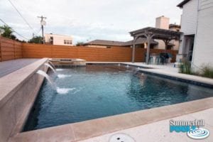 rectangle pool with spa and water features