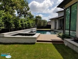 new pool with wood decking