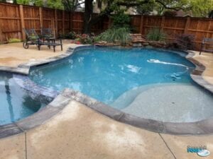 new pool construction with rock waterfall
