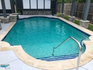 renovated pool with blue tile on steps