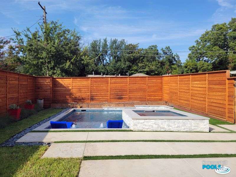 pool with concrete pavers